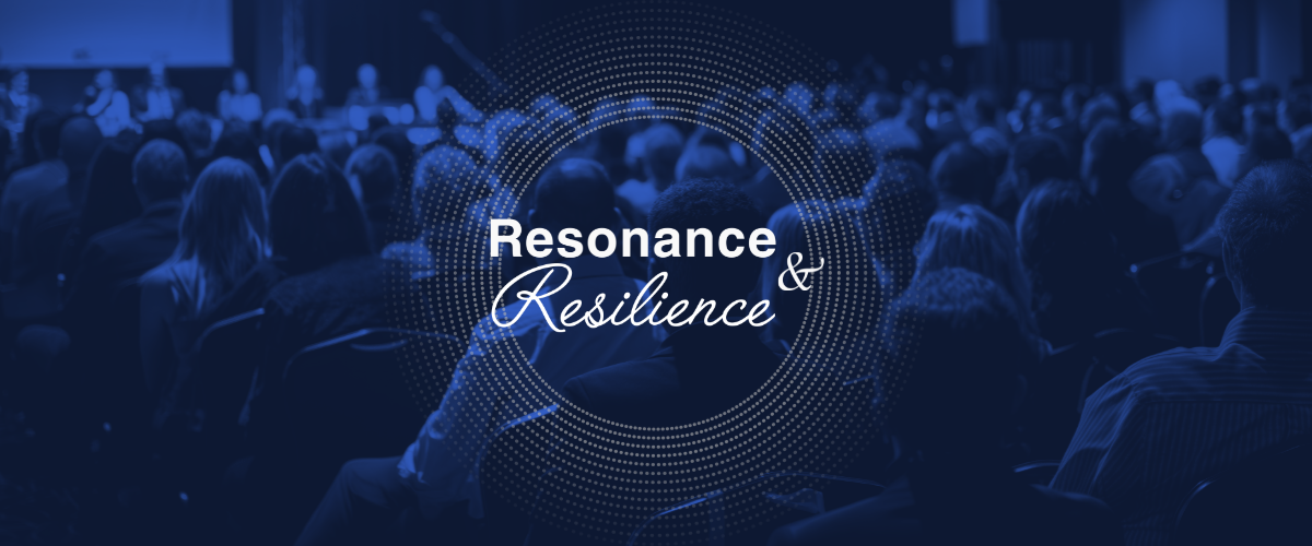 Blue-toned conference banner with the words “Resonance & Resilience” centered inside a circular dotted design, over a blurred audience watching a speaker at the front of a presentation room.